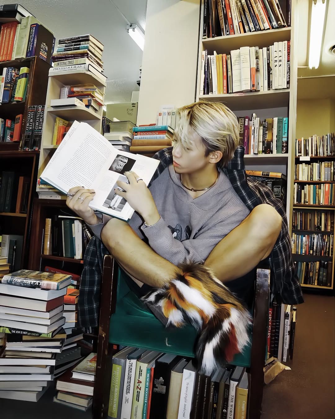 Creative environmental portrait among books